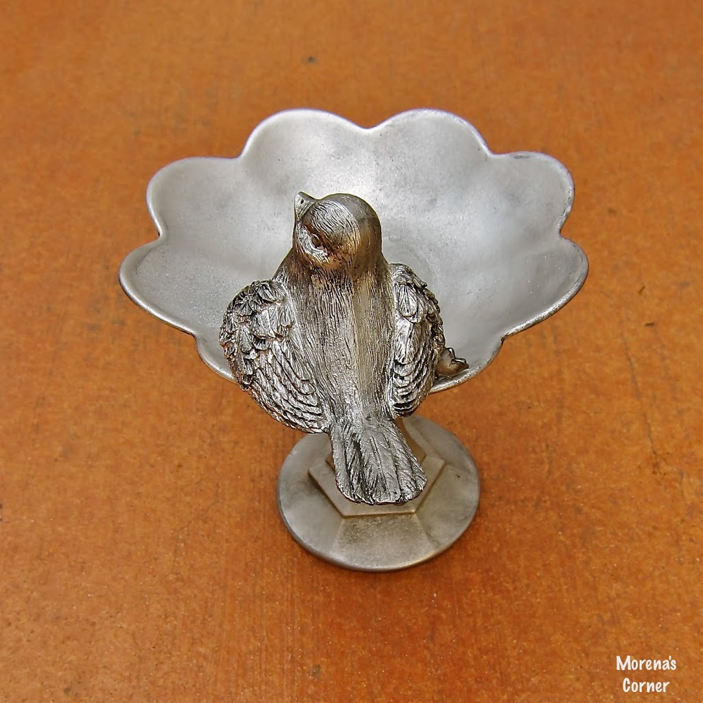 a side view of faux pewter dish