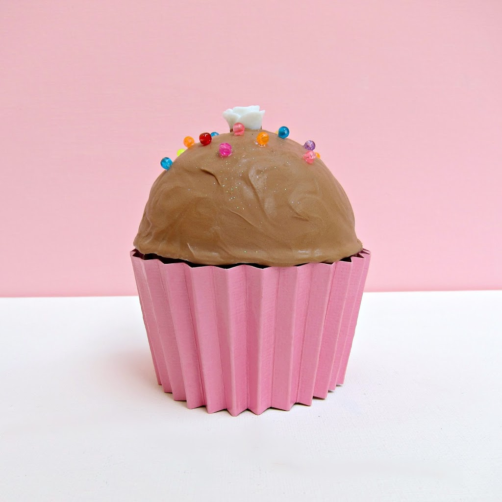 Turn paper mache boxes into realistic looking cupcake gift boxes! This cute favor box is fun to make and even more fun to give!
