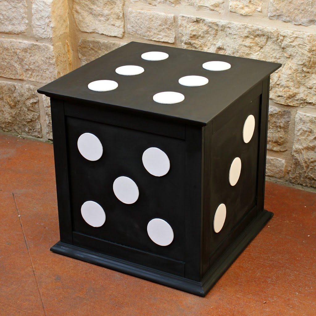 Turn a boring storage piece into a fun piece of decor by using wood pieces and chalk paint.