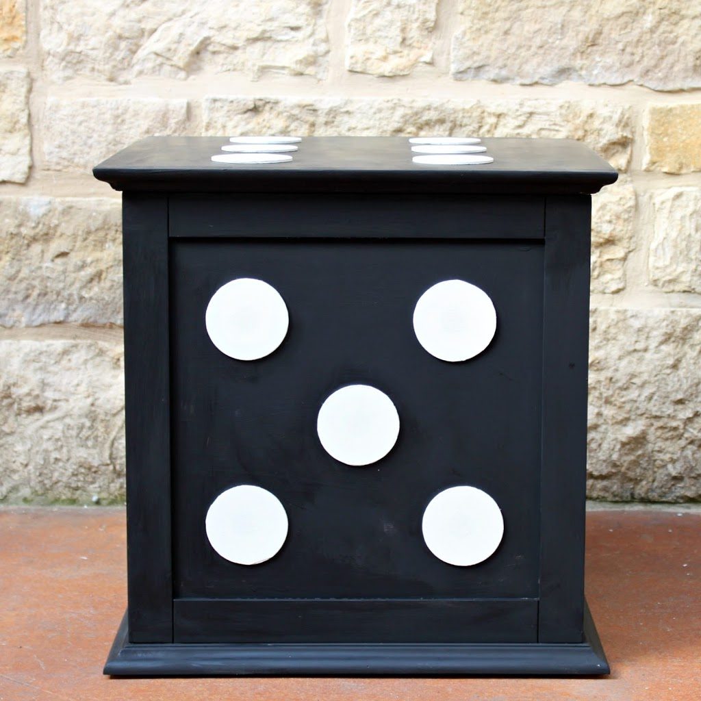 Turn a boring storage piece into a fun piece of decor by using wood pieces and chalk paint.