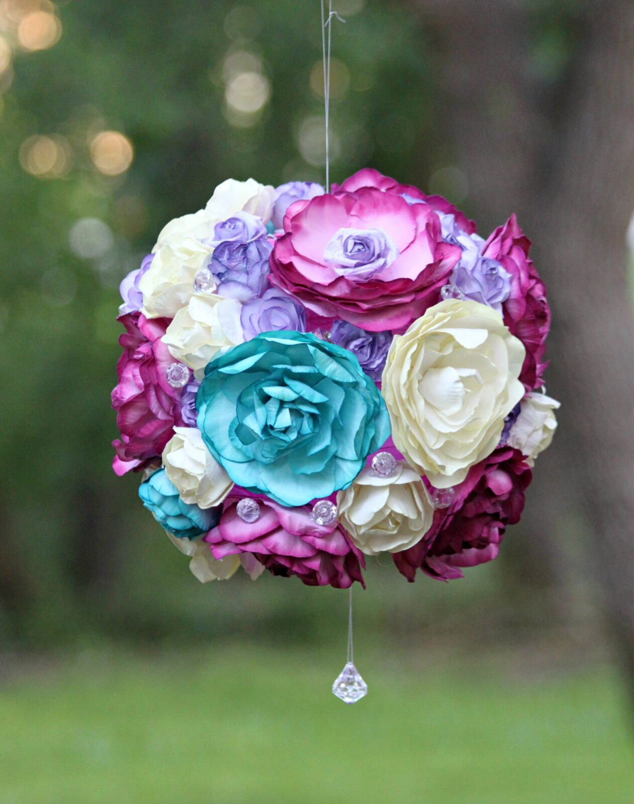 Create a beautiful floral garden party light that is inspired by flower pomanders. This easy to customize project is a beautiful party accent!