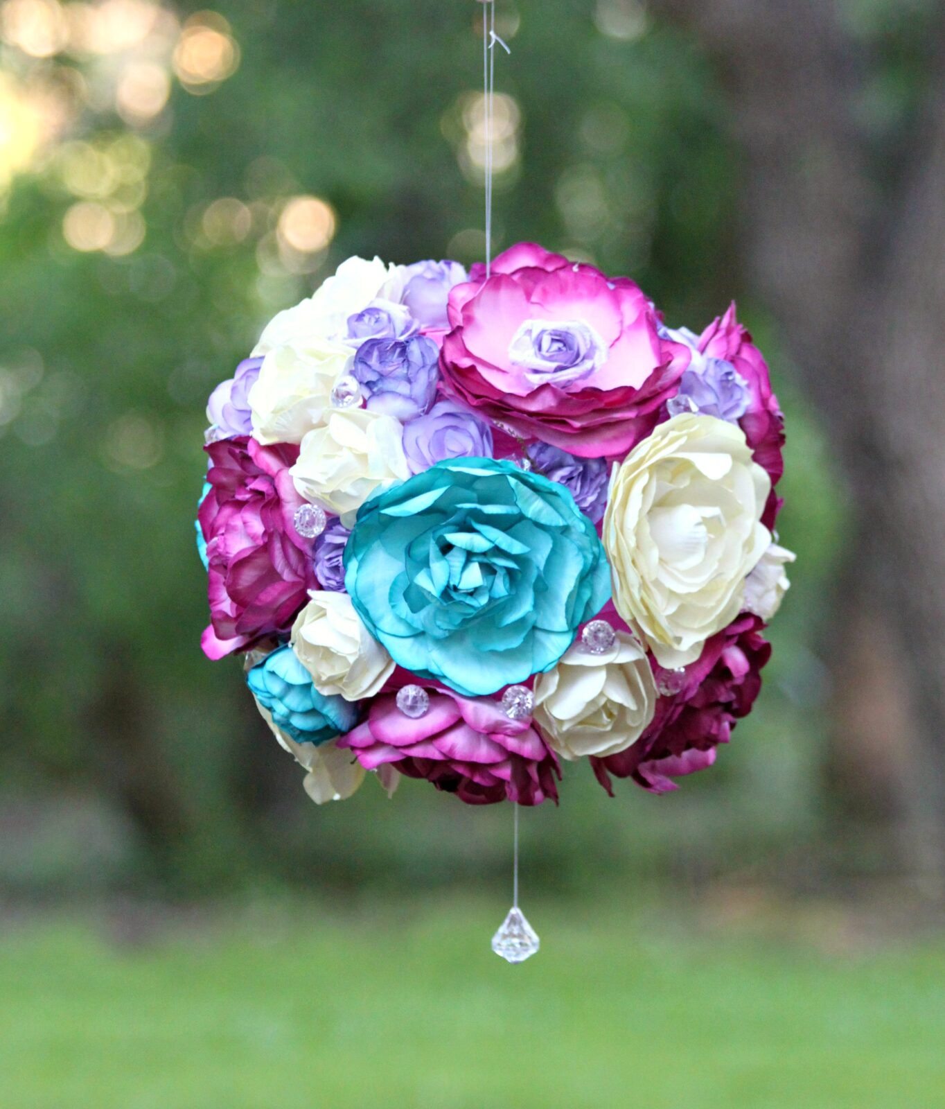 Create a beautiful floral garden party light that is inspired by flower pomanders. This easy to customize project is a beautiful party accent!