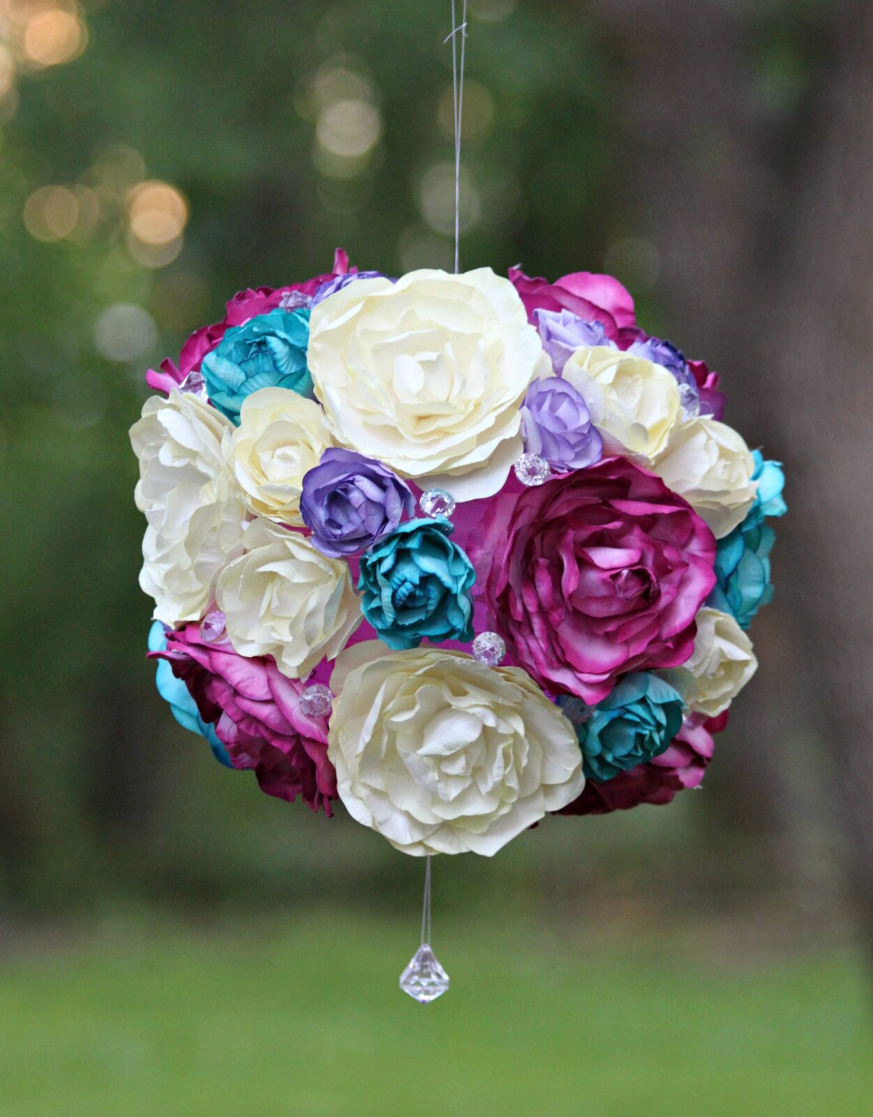 Create a beautiful floral garden party light that is inspired by flower pomanders. This easy to customize project is a beautiful party accent!