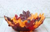 Make a DIY leaf bowl. Turn artificial leaves into a gorgeous shaped bowl. Use Mod Podge and dollar store leaves to create this stunning piece of decor!