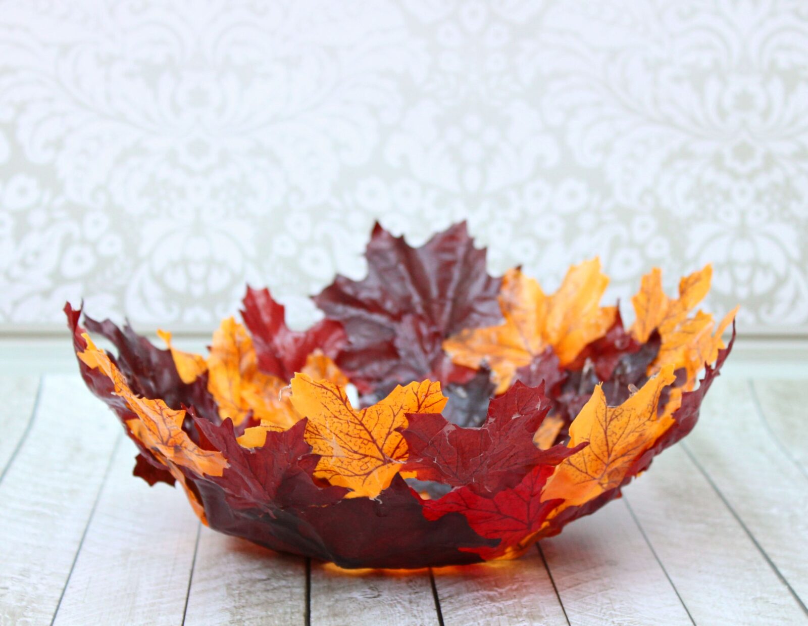 Make a DIY leaf bowl. Turn artificial leaves into a gorgeous shaped bowl. Use Mod Podge and dollar store leaves to create this stunning piece of decor!