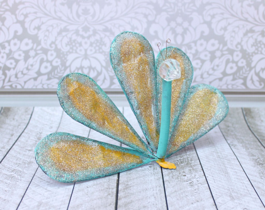 Turn a whisk into fun DIY peacock garden art.