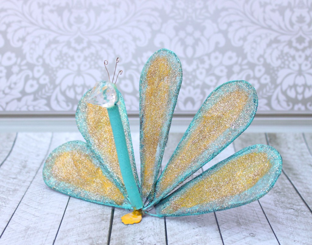 Turn a whisk into fun DIY peacock garden art.