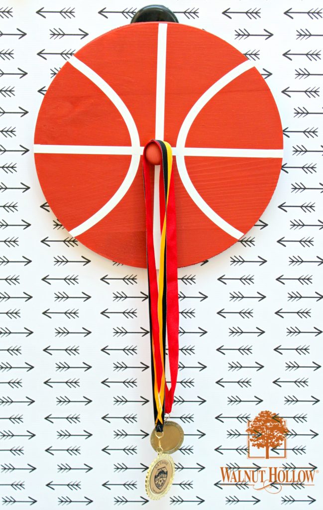 Turn unfinished wood pieces into sporty wall hooks to organize your stuff.