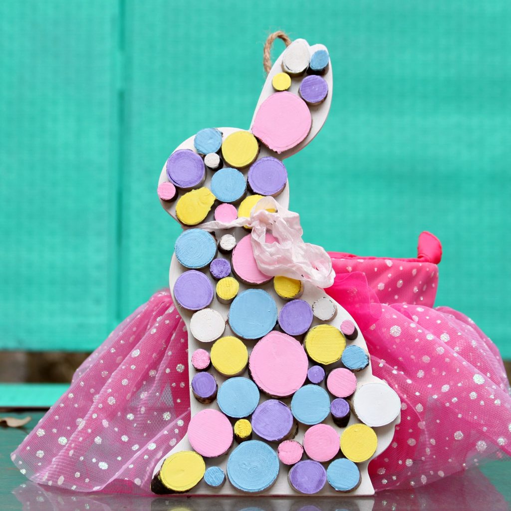 Decorate your home this spring with a pretty pastel wood rounds bunny. Use unfinished wood to create a unique piece of home decor.