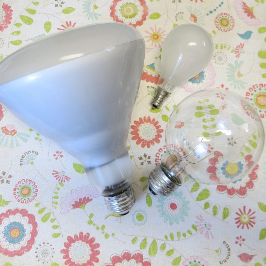 Make light bulb hot air balloons to create whimsical recycled decor. Perfect for Earth Day crafts or any day outdoor decor!