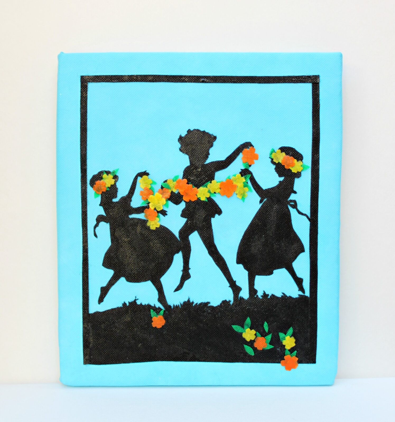 Create detailed silhouette wall art by using non fraying fabric and foam boards.
