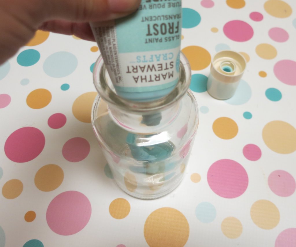 Make coastal bottle decor to bring the beach home with you. Use glass paint and souvenir shells to create beach themed home decor.