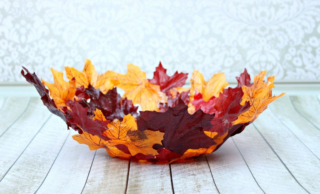 Make a DIY leaf bowl. Turn artificial leaves into a gorgeous shaped bowl. Use Mod Podge and dollar store leaves to create this stunning piece of decor!