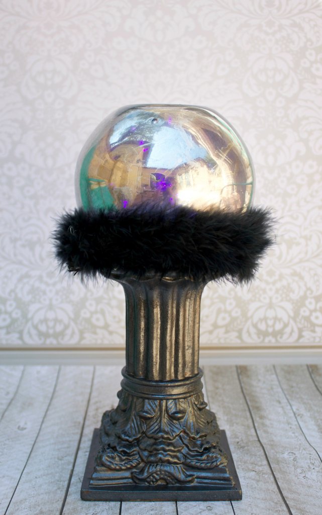 Combine thrift store items with purple party lights to create an amazing crystal ball that glows! This fun Halloween craft project makes great decor!