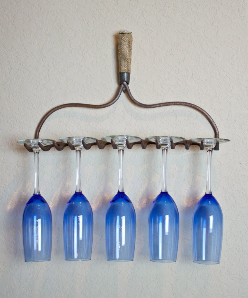 turn a rake into a rustic wine glass holder