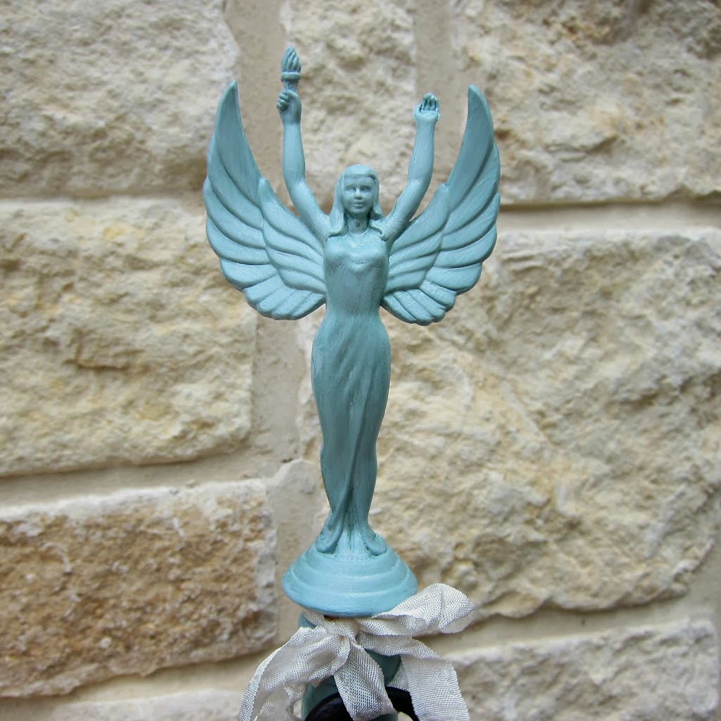 Make a trophy bottle stopper by upcycling thrifted items from Goodwill! Create beautiful home decor for pennies with recycled goods.