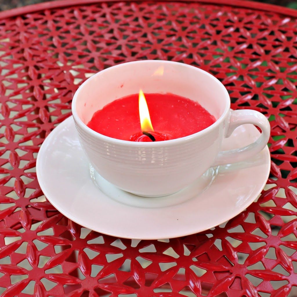 Use thrifted cups, saucers, and candles to create a lovely tea cup candle. These candles are just perfect for summer nights!