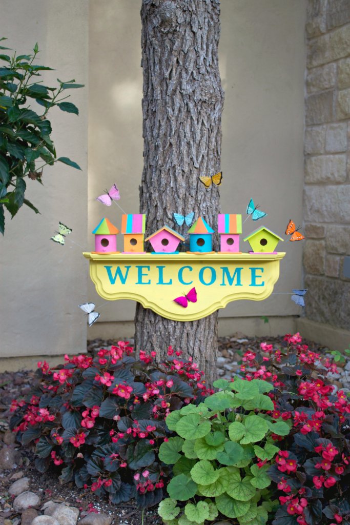 Create a colorful birdhouse welcome sign to greet springtime and guests to your home. This cheery project is a fun simple craft.