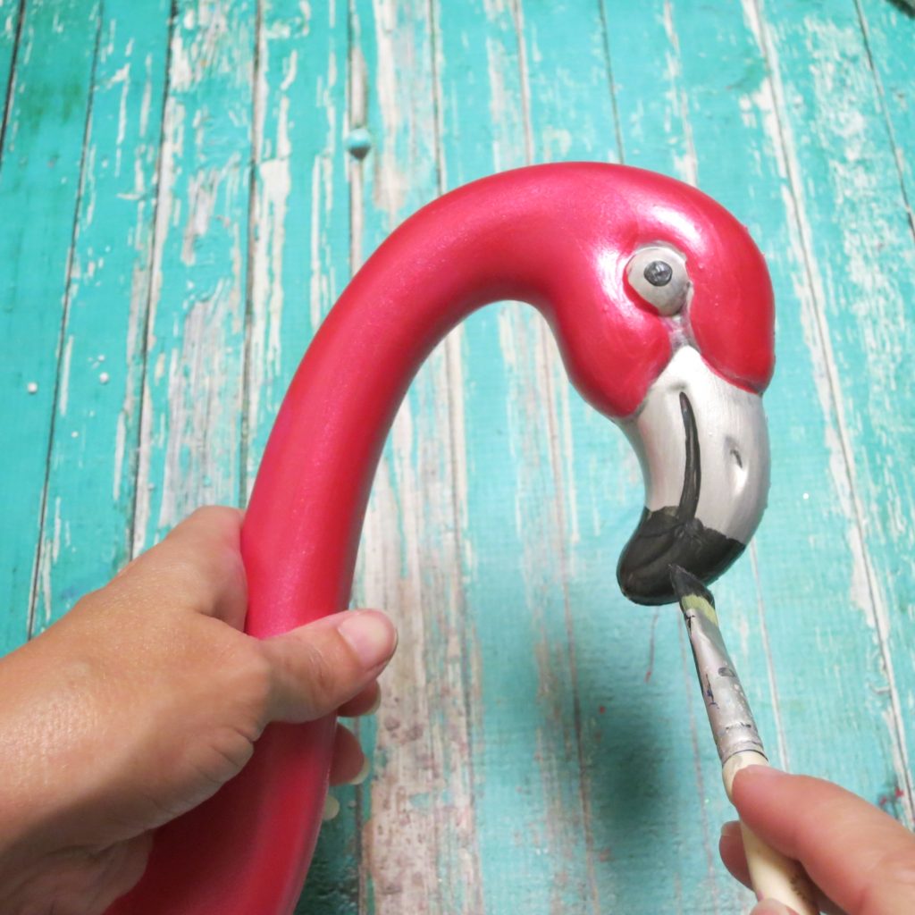 Let me show you how simple it is to turn plastic pink flamingoes into faux metallic flamingo planters for your home.