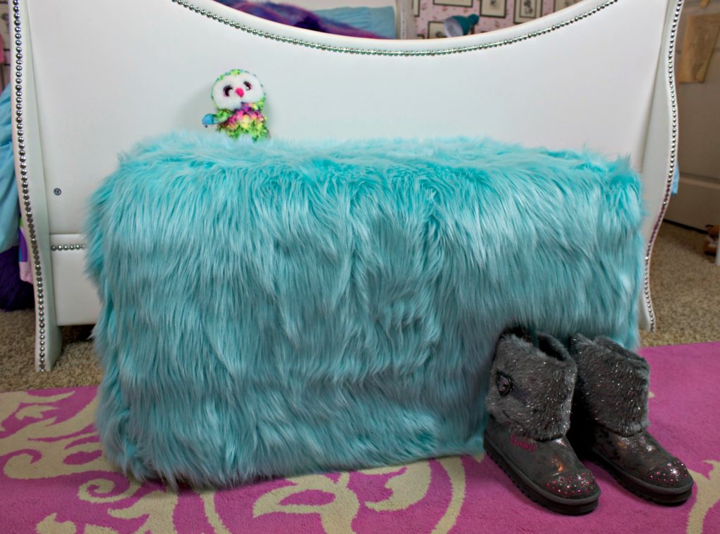 Transform an outdated ottoman from Goodwill San Antonio into a fun piece of dorm decor in under one hour! This ottoman slipcover DIY is Easy to make.