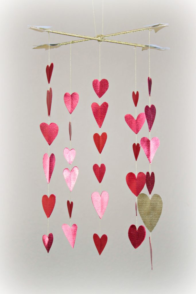 Make a shimmery heart mobile to decorate your room with for Valentine's day!