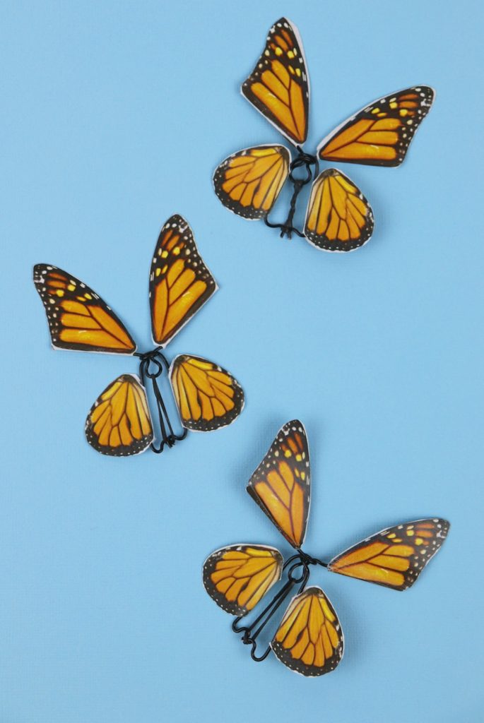 Make a butterfly fidget spinner DIY using a free printable, OnlineLabels.com sticker sheets, and craft wire. This spinning craft is mesmerizing!