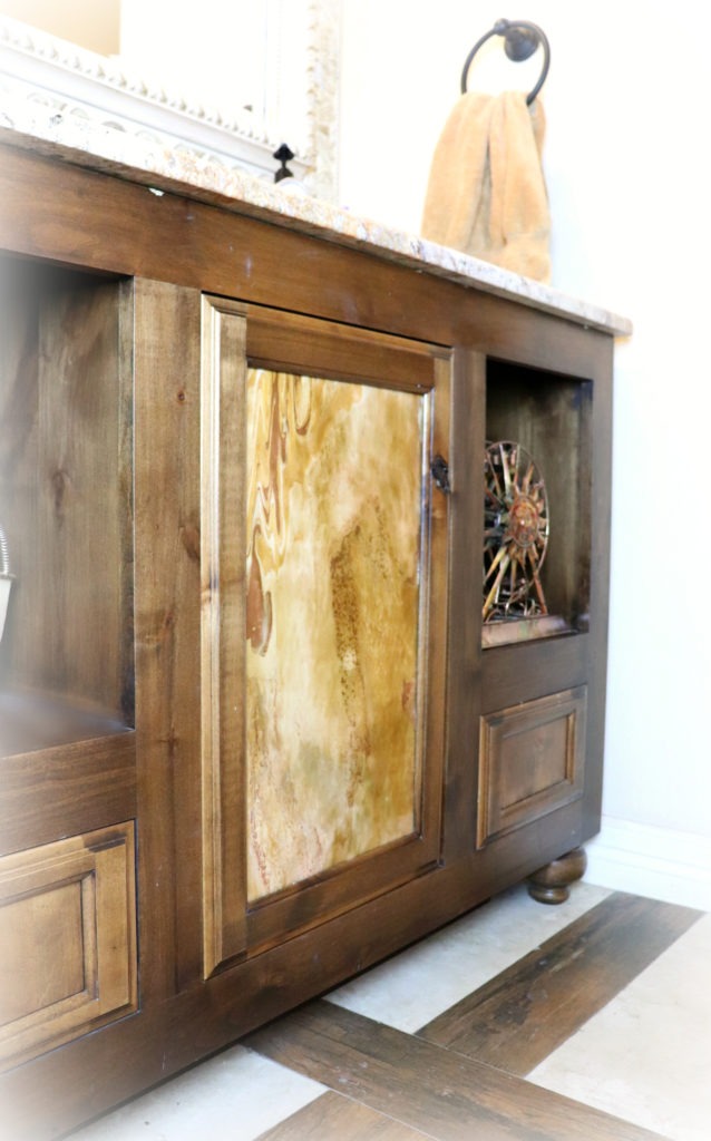 If you haven't caught on to the paint pouring craze yet, let me warn you. It's addicting. DecoArt introduced a new line of paint pouring products, and I decided to try my hand at it. My first project was to tackle this unfinished door that's bothered me for years. I chose colors that matched the stone countertops and got to pouring.