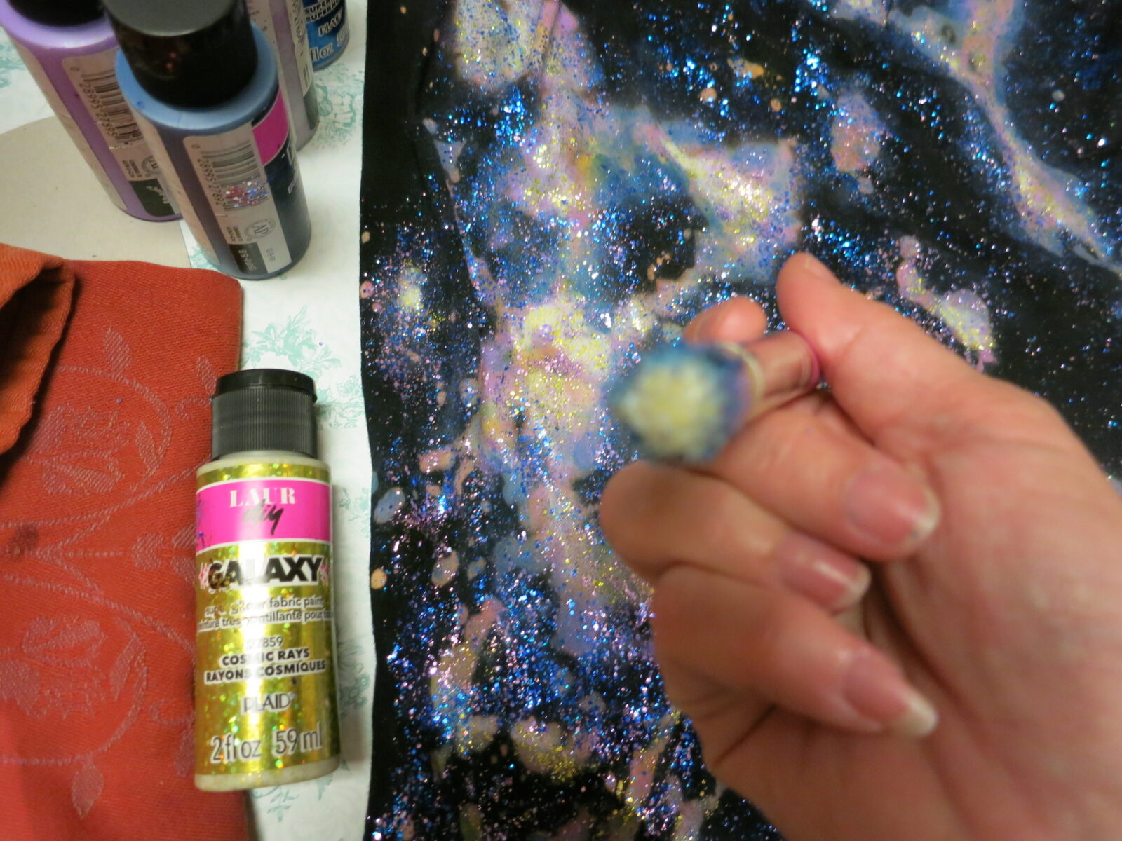 Transform a dress from Goodwill using fabric glitter paints for this awesome galaxy dress DIY.