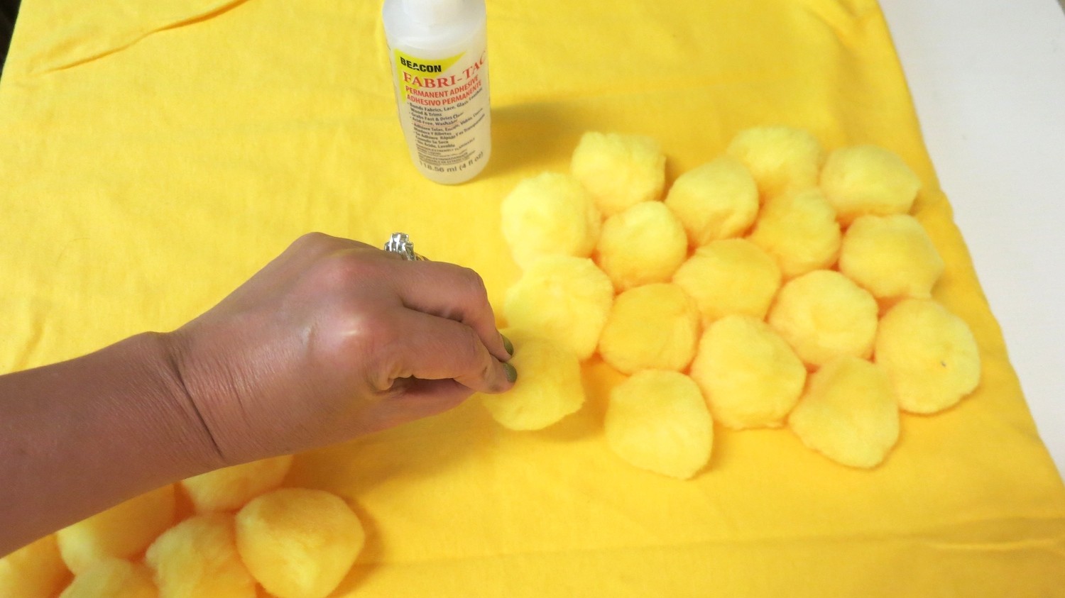 glue pom poms on costume