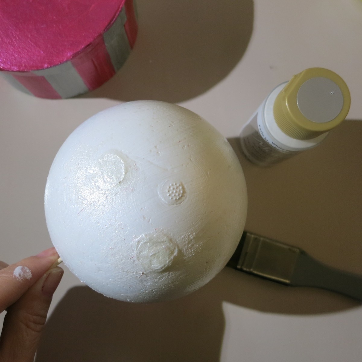 paint a styrofoam ball to make a snowman