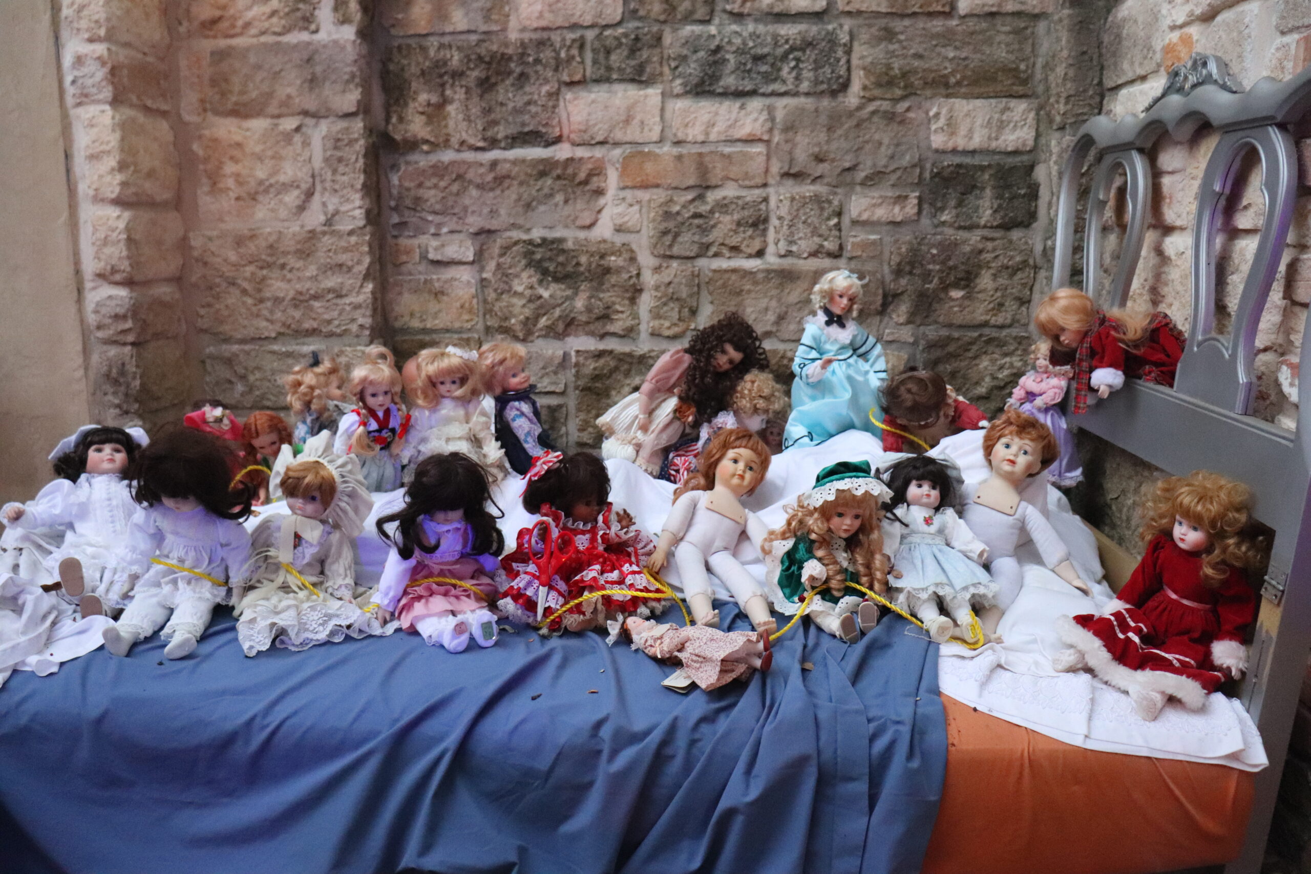 creepy dolls on bed