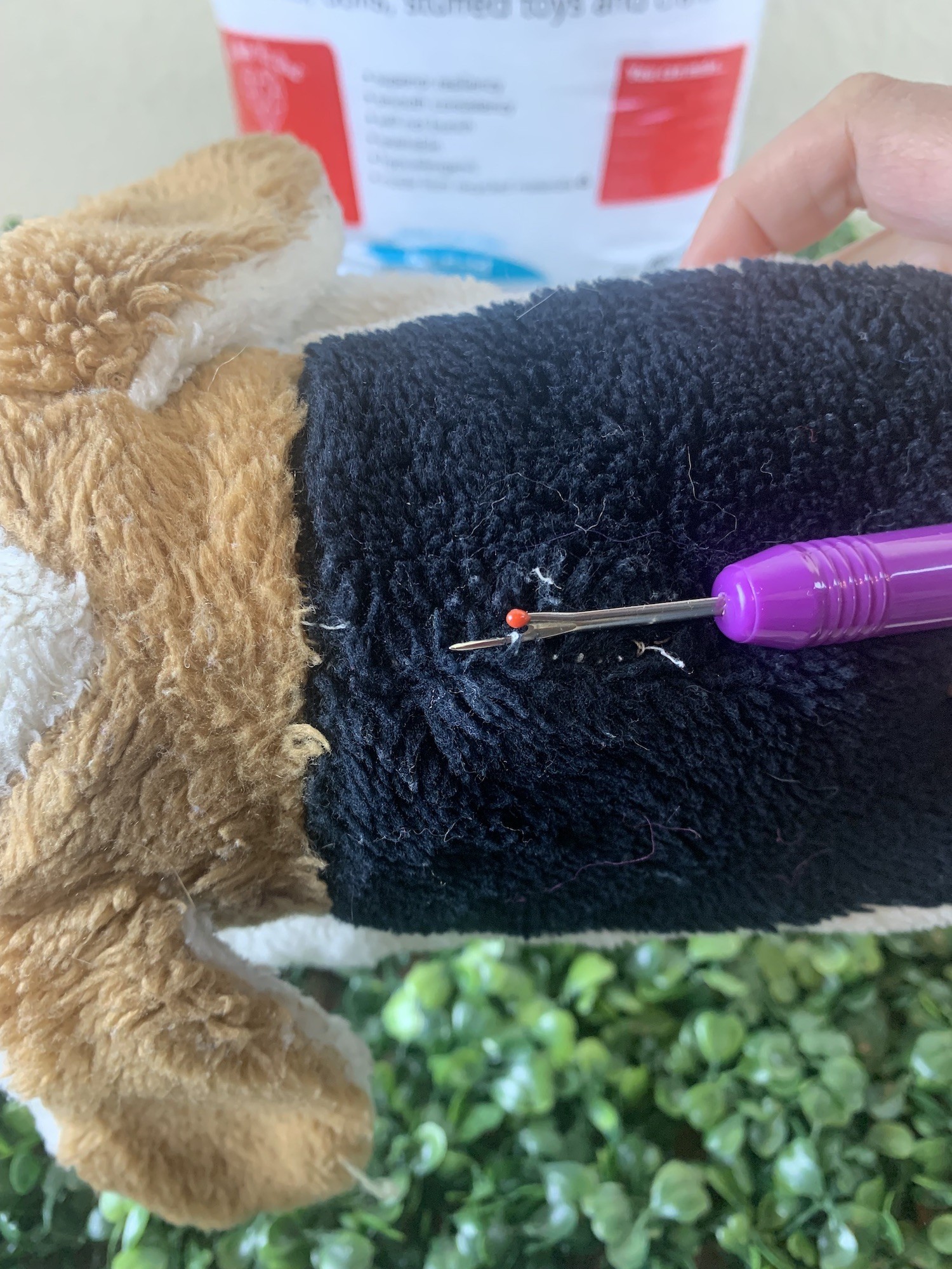 seam ripper on stuffed animal